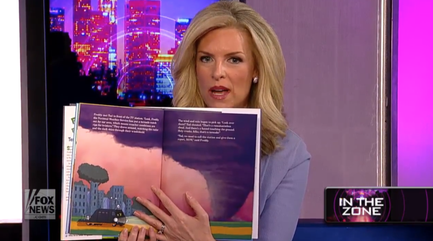 Janice Dean thumbs through her book on air. 