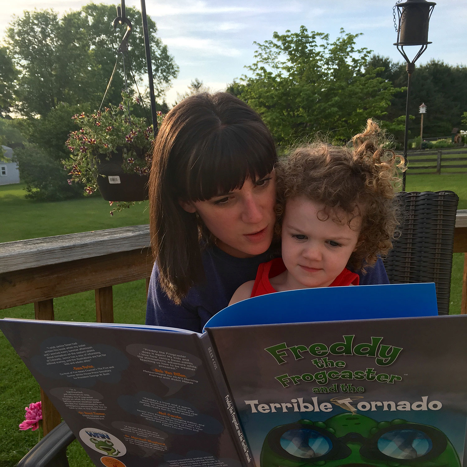 Katie Wheatley of ustornadoes.com reading to her daughter.